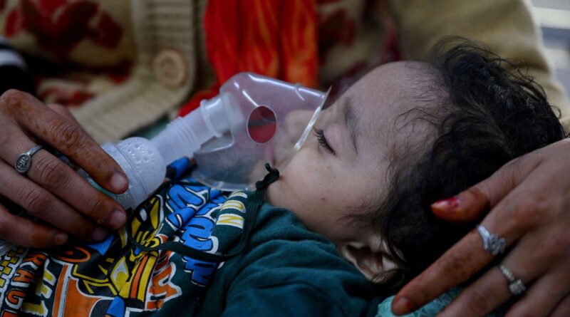 Child using inhaler amid worsening air pollution in India