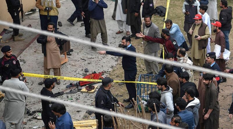 “Security personnel inspecting the area after a blast at a mosque in Islamabad.”