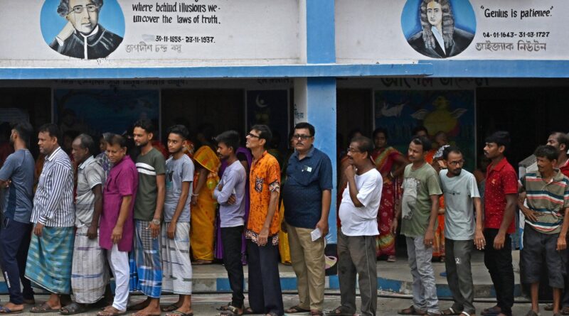 Voters standing in long queues at polling booth in West Bengal election 2026 showing high voter turnout